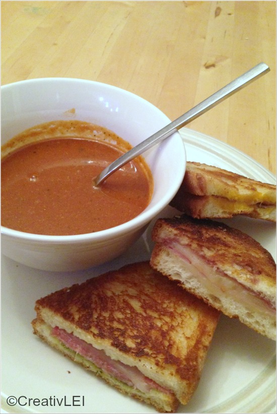 Gourmet-style grilled cheese served with creamy tomato soup