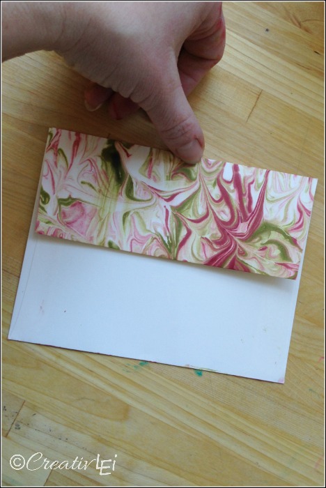 Faux marbled envelope flap using shaving cream and ink refills. CreativLEI.com